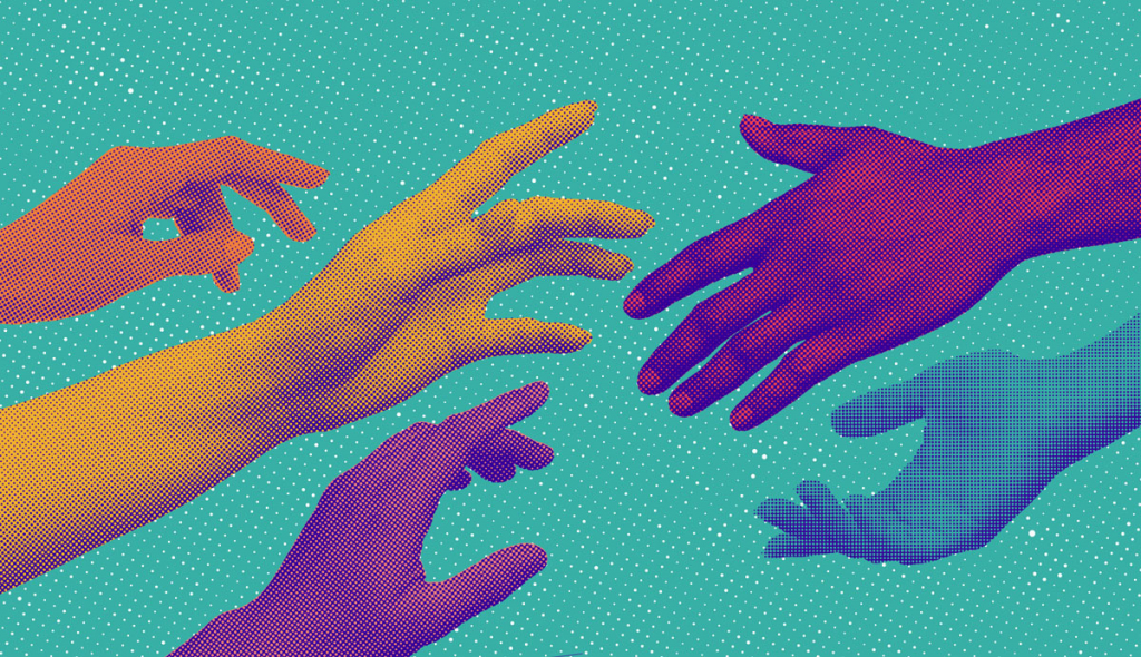 Many hands of different ethnicities reaching out to each other