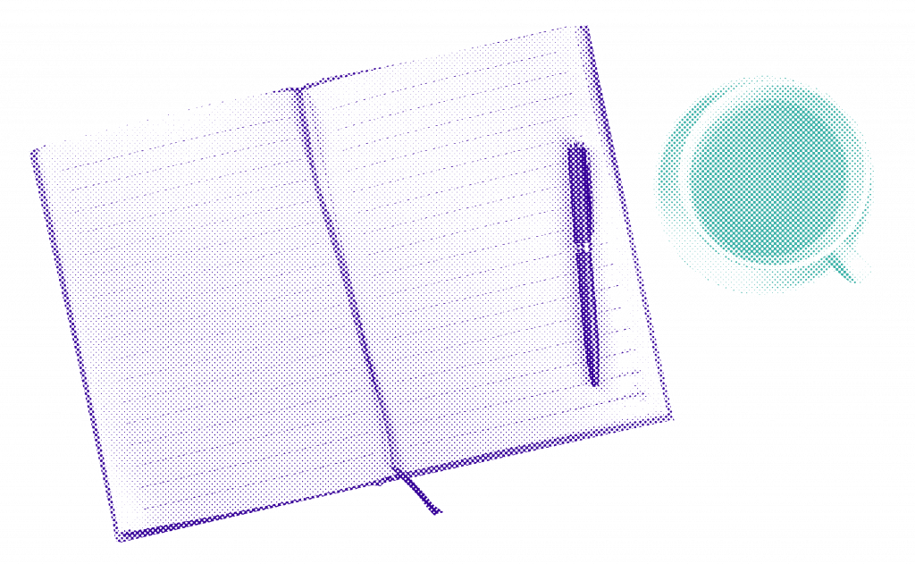 An open journal next to a pen and cup of tea