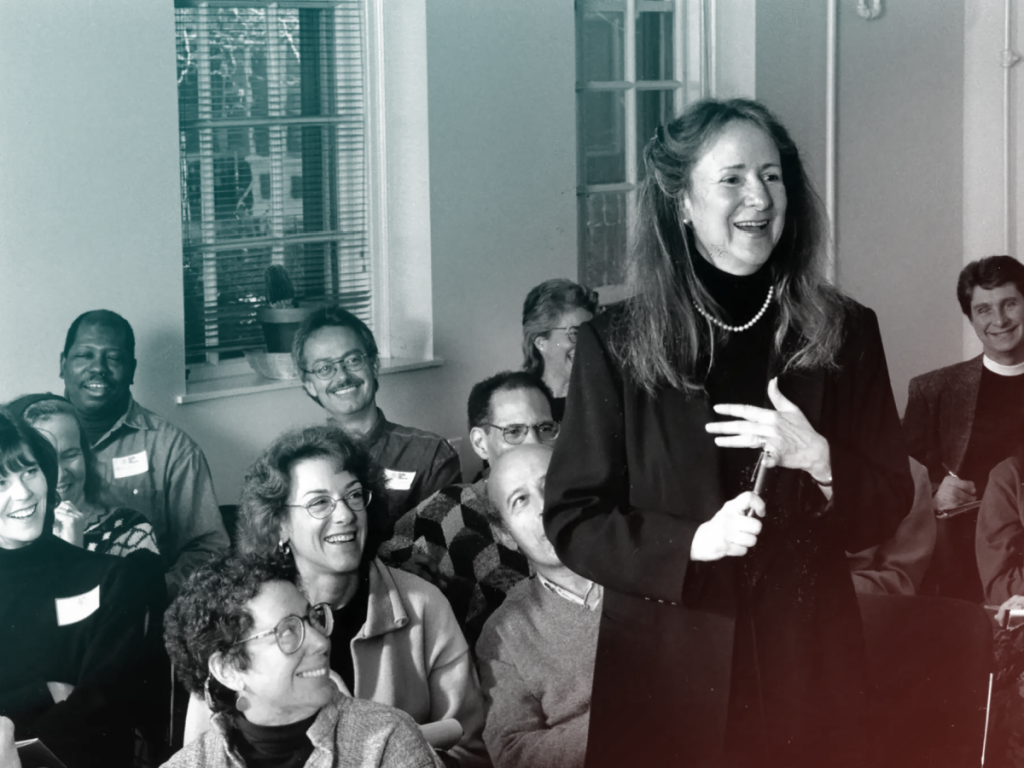 Photo of Margot Stern Strom speaking in a classroom filled with adults.