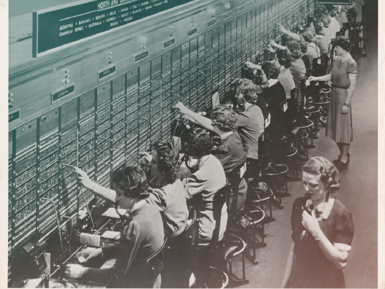 Women working at a telephone switchboard.