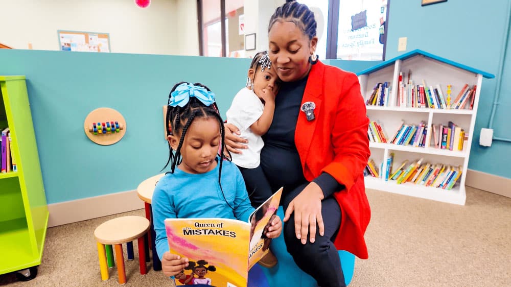 Mother and daughters reading optimized